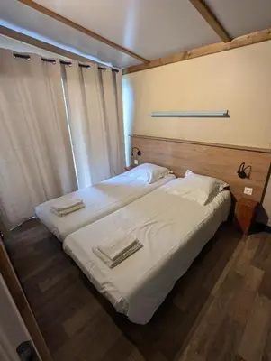 Un ou plusieurs lits dans un hébergement de l'établissement Magnifique Chalet