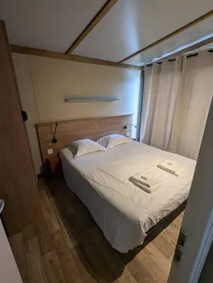 Un ou plusieurs lits dans un hébergement de l'établissement Magnifique Chalet
