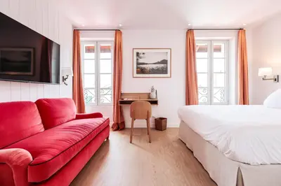 Un ou plusieurs lits dans un hébergement de l'établissement Hotel du Balcon