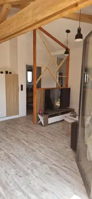 Télévision ou salle de divertissement dans l'établissement Chalet