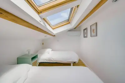 Un ou plusieurs lits dans un hébergement de l'établissement La maison du port – Maison avec piscine à La Teste