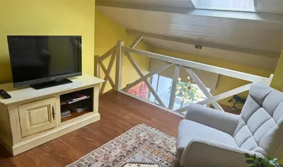 Télévision ou salle de divertissement dans l'établissement L'Aurore - Terrasse - Duplex - Parking