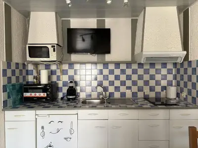 Cuisine ou kitchenette dans l'établissement Ombre et Vague