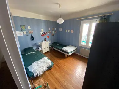 Un ou plusieurs lits dans un hébergement de l'établissement Appartement entre terre et océan
