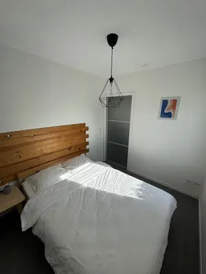 Un ou plusieurs lits dans un hébergement de l'établissement Modern garden apartment