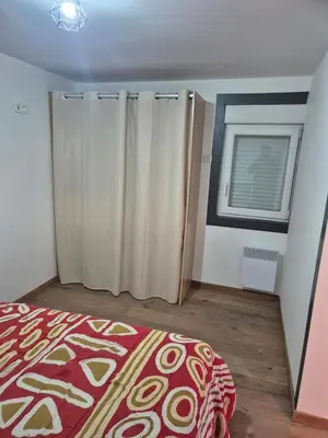 Un ou plusieurs lits dans un hébergement de l'établissement Tres belle maisonnette