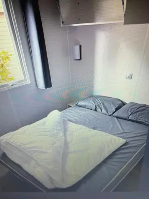 Un ou plusieurs lits dans un hébergement de l'établissement Au Paradis
