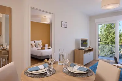 Un ou plusieurs lits dans un hébergement de l'établissement Quality Aparthotel Saint-Paul-lès-Dax