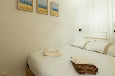 Un ou plusieurs lits dans un hébergement de l'établissement Le mirailh Hyper centre, rénové, lave linge, wifi, coin nuit séparé