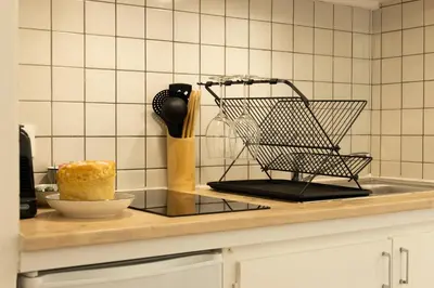 Cuisine ou kitchenette dans l'établissement Le mirailh Hyper centre, rénové, lave linge, wifi, coin nuit séparé