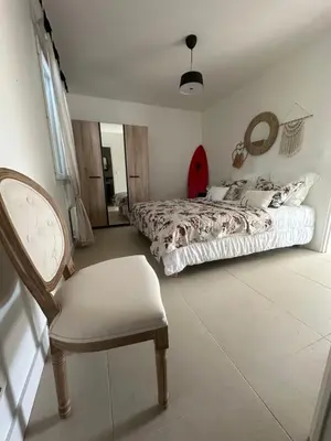 Un ou plusieurs lits dans un hébergement de l'établissement Maison cosy à 10 minutes de la plage