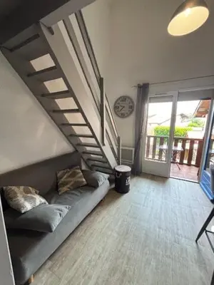Coin salon dans l'établissement Les Cottages 1 - Appartement au bord de l'océan