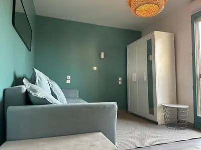Coin salon dans l'établissement Appartement rénové et lumineux - 130