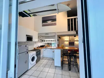 Cuisine ou kitchenette dans l'établissement Le 140, Surf et Confort