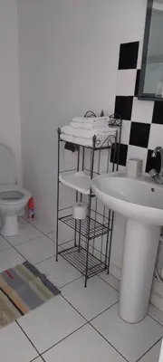 Salle de bains dans l'établissement Le Trianon de Salies
