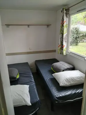 Un ou plusieurs lits dans un hébergement de l'établissement Camping rivages des Landes
