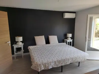 Un ou plusieurs lits dans un hébergement de l'établissement Maison familiale à 6 minutes de l'océan