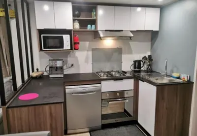 Cuisine ou kitchenette dans l'établissement Dunes 209