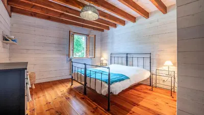 Un ou plusieurs lits dans un hébergement de l'établissement Moulin de Sore -Gîtes 14 pers et chambres d'hôtes dans un lieu naturel préservé