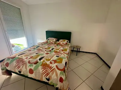 Un ou plusieurs lits dans un hébergement de l'établissement appartement cosy avec terrasse