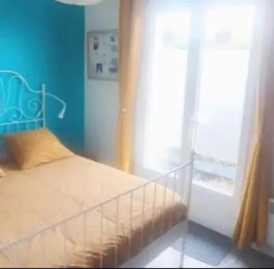 Un ou plusieurs lits dans un hébergement de l'établissement Maison Entre lac et océan