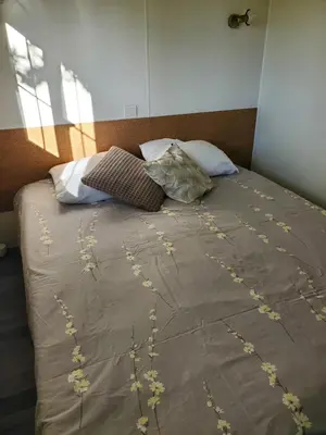 Un ou plusieurs lits dans un hébergement de l'établissement Mobilhome vue sur la lande