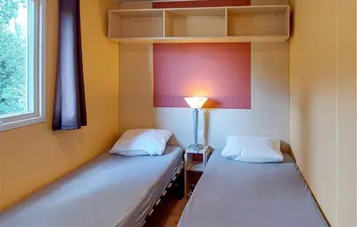 Un ou plusieurs lits dans un hébergement de l'établissement Cozy Stacaravan In Saint-Paul-Lès-Dax