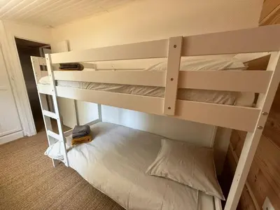Un ou plusieurs lits dans un hébergement de l'établissement La Maison de la forêt et son jaccuzy