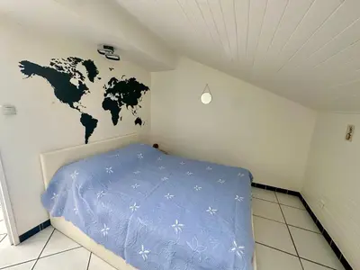 Un ou plusieurs lits dans un hébergement de l'établissement Appartement calme et lumineux