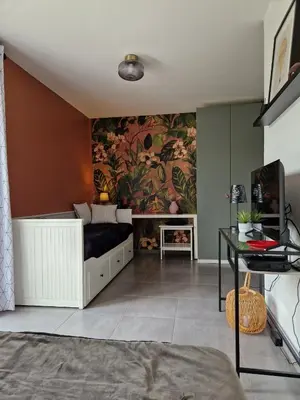 Télévision ou salle de divertissement dans l'établissement Studio du Lac