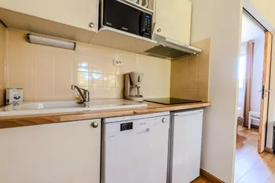 Cuisine ou kitchenette dans l'établissement Appartement de type 2 cabine pour 4 personnes