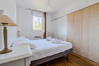 Un ou plusieurs lits dans un hébergement de l'établissement Appartement de type 2 cabine pour 4 personnes