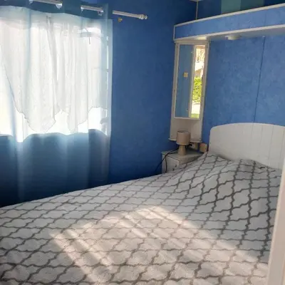 Un ou plusieurs lits dans un hébergement de l'établissement Mobil-home Camping MIMIZAN