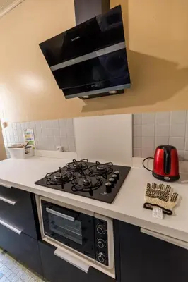 Cuisine ou kitchenette dans l'établissement Au castera