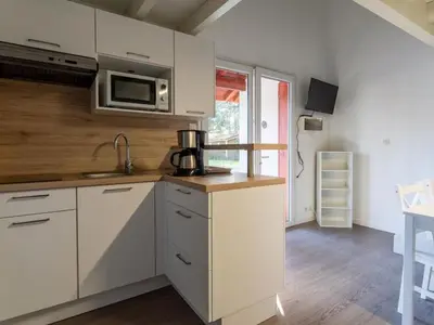 Cuisine ou kitchenette dans l'établissement Appartement 32m² avec Terrasse à Soustons - API-1-52-550