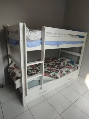 Un ou plusieurs lits dans un hébergement de l'établissement Maison de vacances à Lesperon