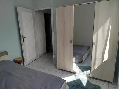 Un ou plusieurs lits dans un hébergement de l'établissement Maison de vacances à Lesperon