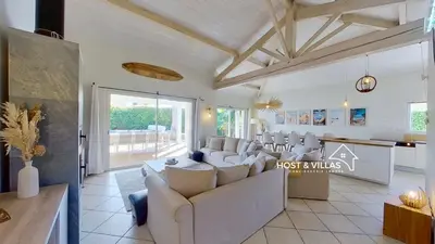 Coin salon dans l'établissement Host Villas LOUMÉA Saubion