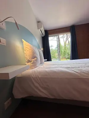 Un ou plusieurs lits dans un hébergement de l'établissement Le Tuc Lodge