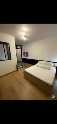 Un ou plusieurs lits dans un hébergement de l'établissement Le cosy de Tom