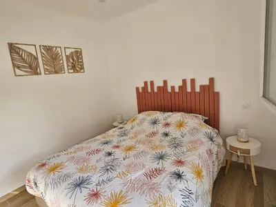 Un ou plusieurs lits dans un hébergement de l'établissement Appartement entouré de verdure