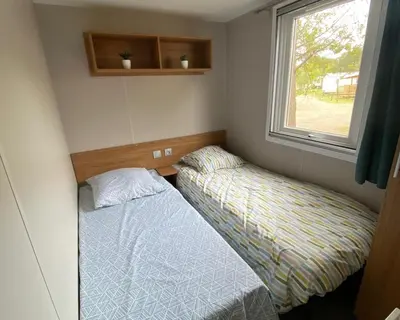 Un ou plusieurs lits dans un hébergement de l'établissement La Plage 4 étoiles emplacement C04 8 personnes 3 chambres 2 SDB