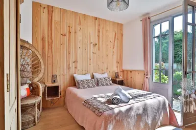 Un ou plusieurs lits dans un hébergement de l'établissement Villa Honora - Joli maison arcachonnaise à Cazaux