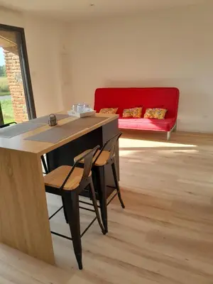 Coin salon dans l'établissement Appartement dans grange rénovée