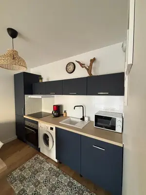Cuisine ou kitchenette dans l'établissement Appartement neuf