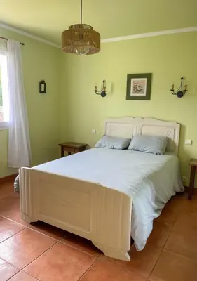 Un ou plusieurs lits dans un hébergement de l'établissement Maison chaleureuse