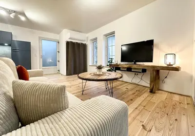 Télévision ou salle de divertissement dans l'établissement Les Suites de Molière
