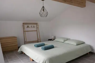 Un ou plusieurs lits dans un hébergement de l'établissement Gite du Lac T2