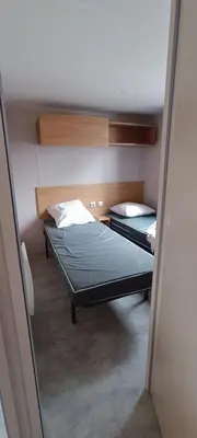 Un ou plusieurs lits dans un hébergement de l'établissement Mobil home chez Thierry et Véro