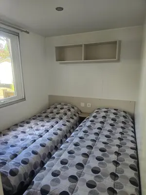 Un ou plusieurs lits dans un hébergement de l'établissement Mobil home 8 personnes Gastes